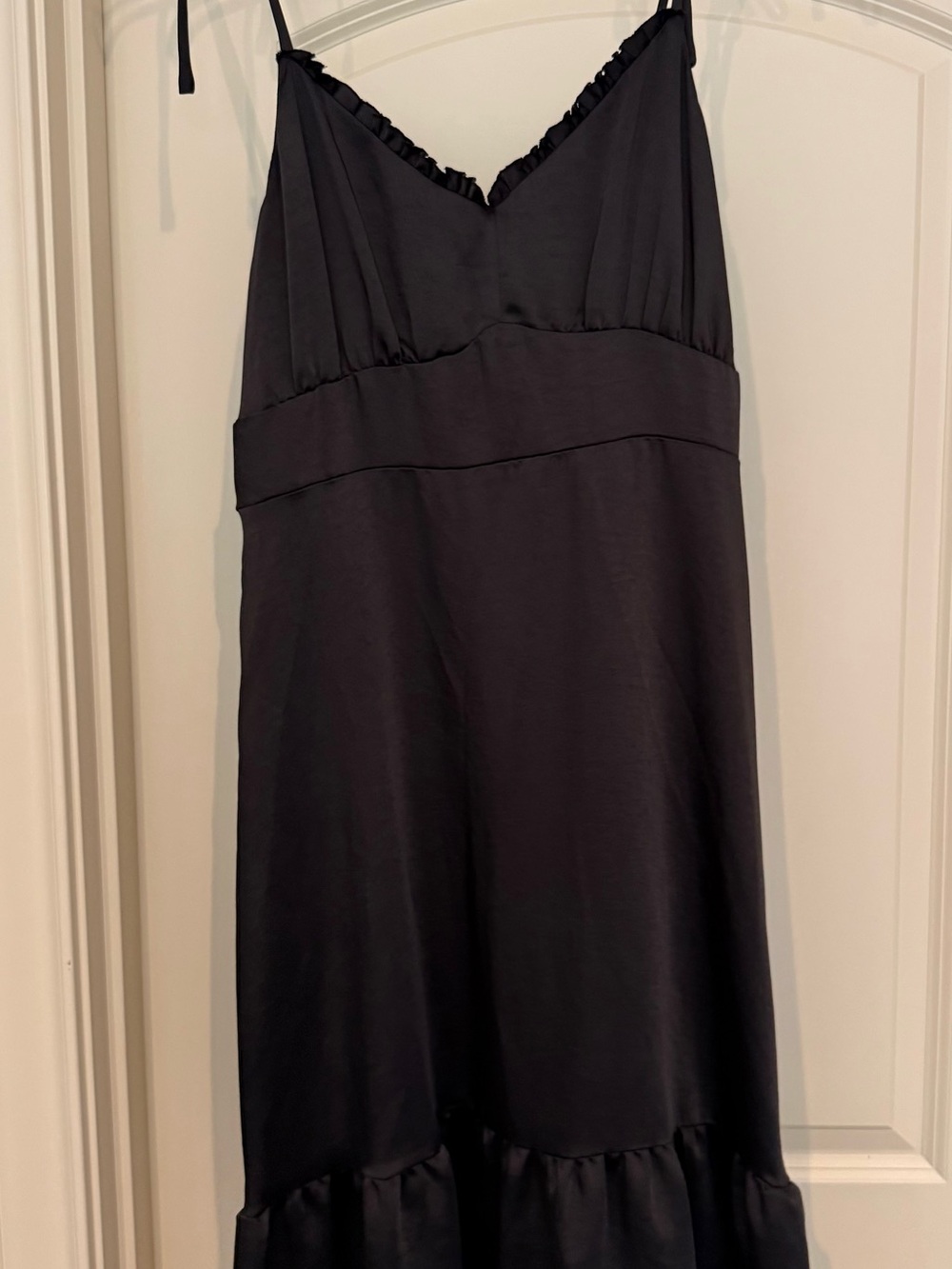 Nine West Black Label Tag on Dark Fabric